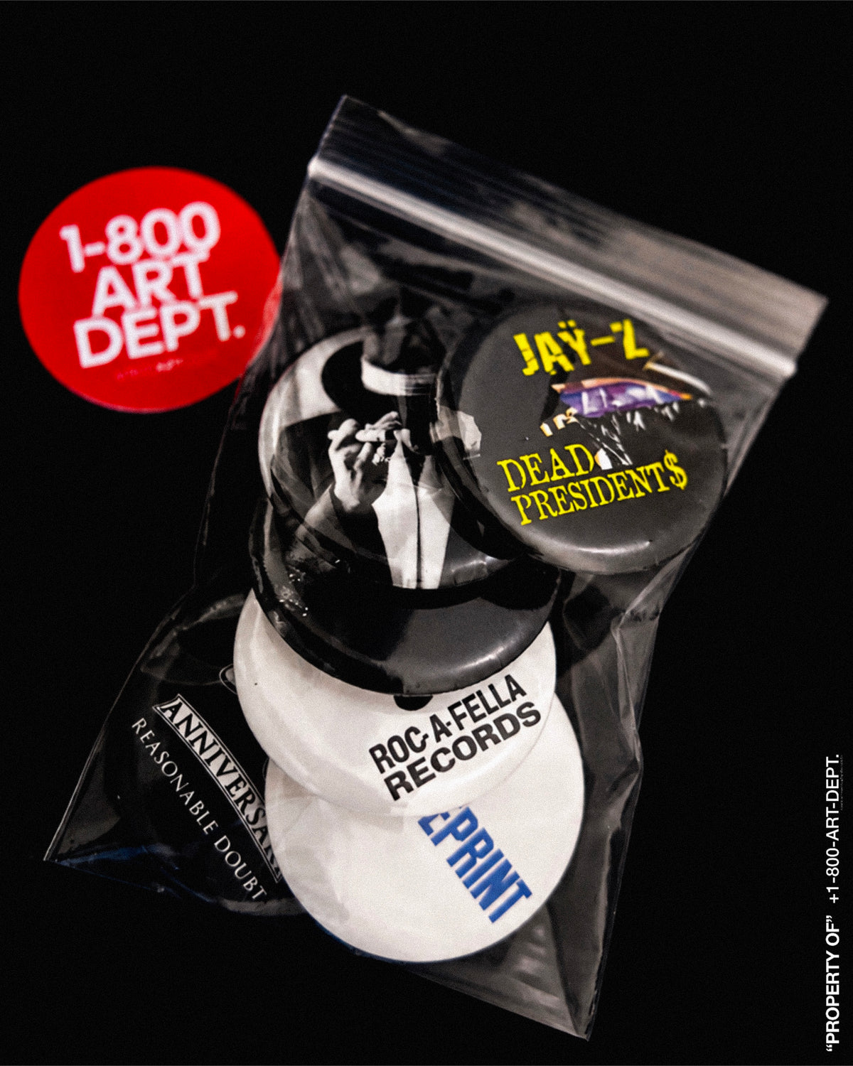 Six commemorative hip-hop graphic buttons from Untitled_Artwork 593.jpg, featuring the Roc-A-Fella Records logo, The Blueprint text, the Roc diamond hands sign, and Reasonable Doubt 30th Anniversary emblems arranged symmetrically.
